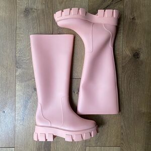 ASOS Design knee high rain boots.